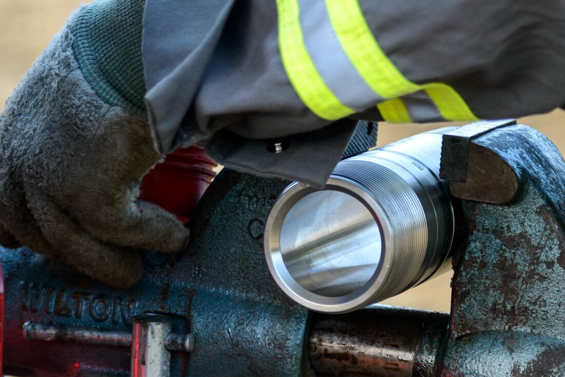 Close-up of a pressure control tool being serviced
